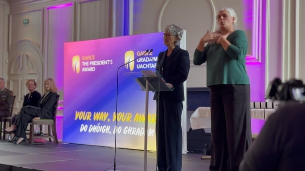 President Catherine Connolly speaks on stage at the Gaisce Gold Awards