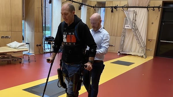 Wayne Garrett using the exoskeleton device
