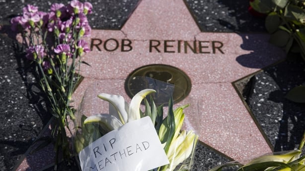  Flowers are seen placed on Rob Reiner's Hollywood Walk of Fame Star