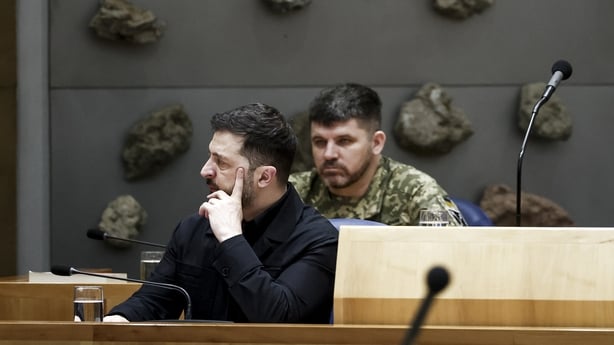 Ukrainian President Volodymyr Zelensky listens during a session in The Netherlands' House of Representatives in The Hague 