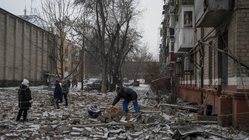 People sift through rubble following a bomb attack on a residential area in Kramatorsk, Ukraine