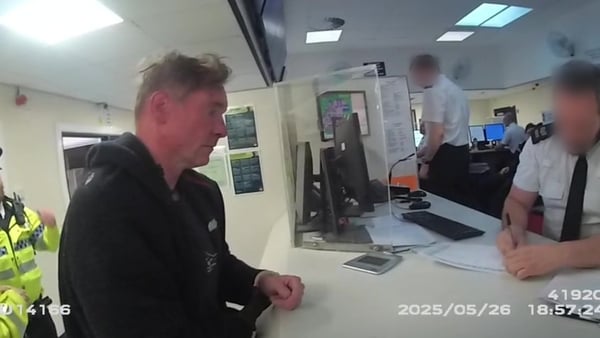 Screen grab taken from bodyworn video issued by Merseyside Police dated 26/05/25 of Paul Doyle being taken to the custody suite following his arrest. Paul Doyle, 54, has been sentenced at Liverpool Crown Court to 21 years and six months in prison after he