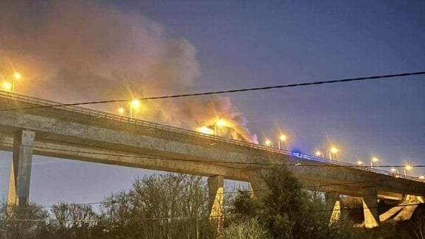 Smoke from a vehicle fire can be seen from below the M50