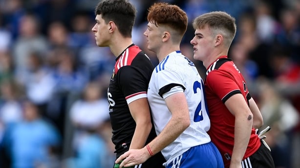 Northern Ireland , United Kingdom - 30 July 2021; Seán Jones of Monaghan is marked by Down goalkeeper Charlie Smyth, left, and Ryan Magill of Down during the EirGrid Ulster GAA Football U20 Championship Final match between Down and Monaghan at Athletic Grounds in Armagh. (Photo By Piaras Ó Mídheach/