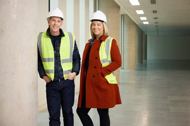 Dermot Bannon and Claire Irwin wearing hi-vis vests and hard hats