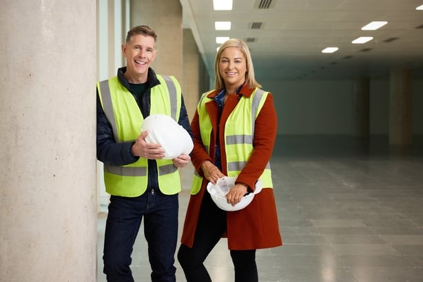 Dermot Bannon and Claire Irwin wearing hi-vis vests and hard hats