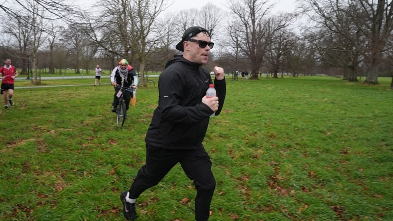 Kneecap member Naoise Ó Cairealláin, aka Móglaí Bap, runs through Dublin's Phoenix Park during a 10K charity run from Dalymount Park to the Áras in Dublin