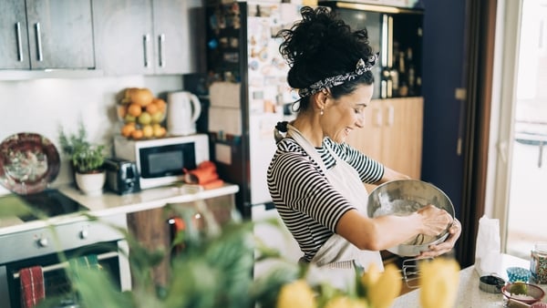 Close-up of a beautiful woman baking muffins