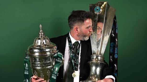 9 November 2025; Shamrock Rovers manager Stephen Bradley poses for a photograph with the FAI Cup and SSE Airtricity Men's Premier Division trophy following the 2025 Sports Direct Men's FAI Cup Final match between Shamrock Rovers and Cork City at the Aviva Stadium in Dublin. Photo by Stephen McCarthy