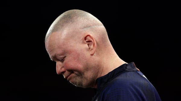 Raymond van Barneveld of the Netherlands looks dejected against Stefan Bellmont of Switzerland (not pictured) during the Round One match between Raymond van Barneveld and Stefan Bellmont at Alexandra Palace on December 17, 2025 in London, England. (Photo