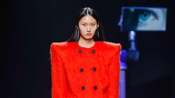 model wearing 80s style red jacket