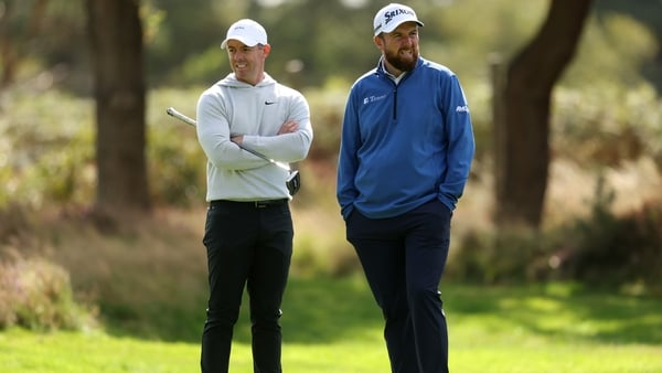 VIRGINIA WATER, ENGLAND - SEPTEMBER 12: Rory McIlroy of Northern Ireland and Shane Lowry of Ireland talk on the ninth hole on day two of the BMW PGA Championship 2025 at Wentworth Golf Club on September 12, 2025 in Virginia Water, England. (Photo by Kate