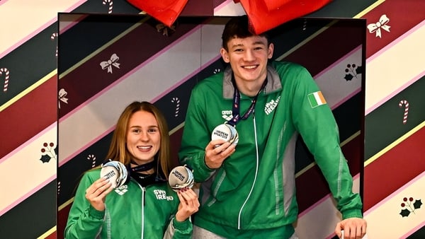 8 December 2025; Team Ireland swimmers, from left, Daniel Wiffen, Ellen Walshe, John Shortt and Evan Bailey with their medals at Dublin Airport on return from the European Short Course Swimming Championships at Lublin in Poland. Photo by Piaras Ó Mídheach