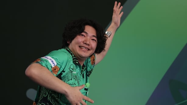 LONDON, ENGLAND - DECEMBER 18: Motomu Sakai of Japan walks on for his match on Day Eight of the 2025/26 Paddy Power World Darts Championship at Alexandra Palace on December 18, 2025 in London, England. (Photo by Andrew Redington/Getty Images)