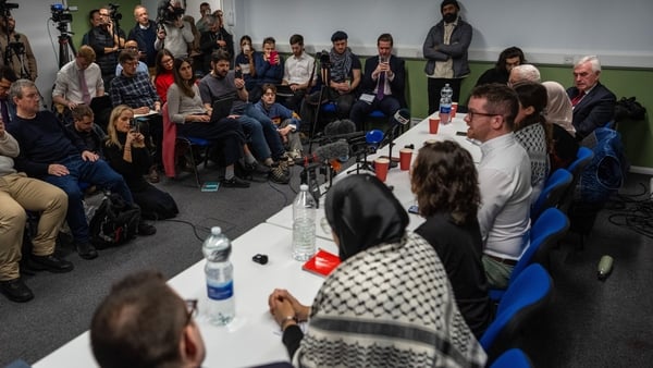 Dr James Smith speaks at a press conference alongside others
