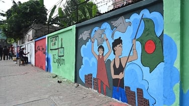 Why are there so many murals all over the streets of Dhaka?