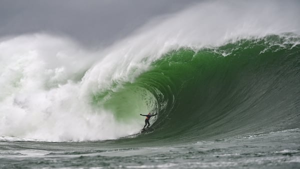 A surfer in a massive swell in Mullaghmore