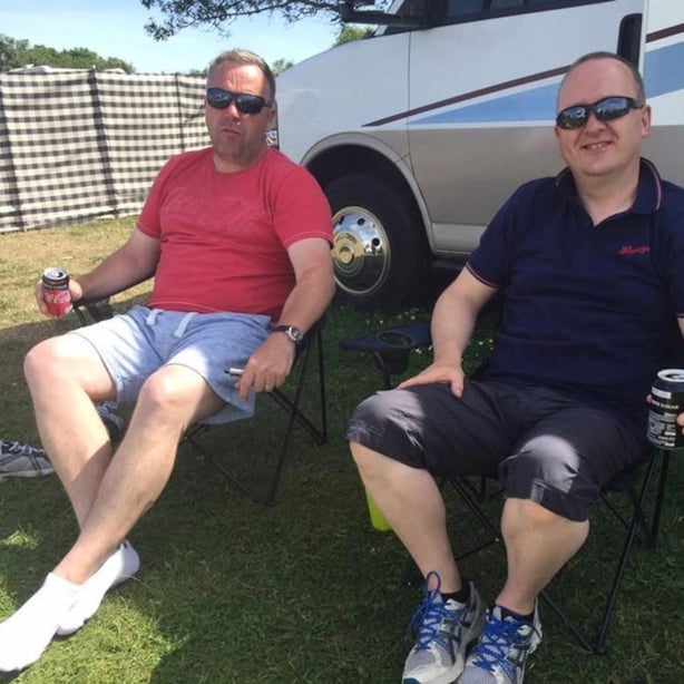 Pat Doyle and Alan Bollard relaxing on foldable chairs