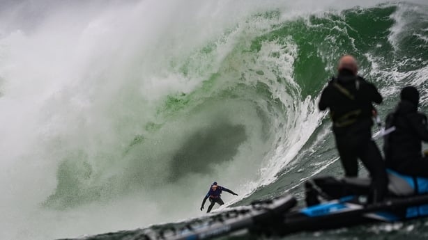 A surfer in a massive swell in Mullaghmore