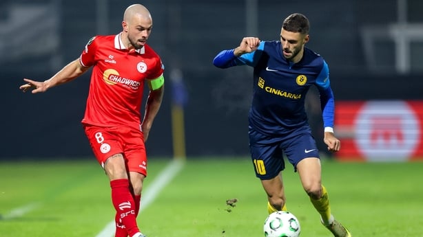 Shelbourne's Mark Coyle in action against Danijel Sturm of NK Celje