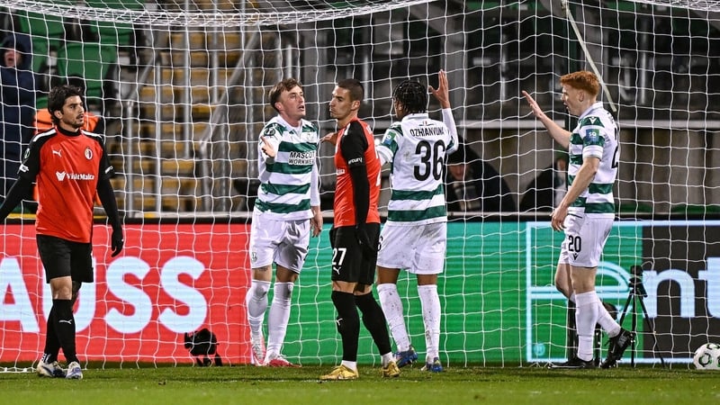 Danny Grant celebrates with Shamrock Rovers team-mate Victor Ozhianvuna, centre, and Rory Gaffney, right, after scoring his side's second goal
