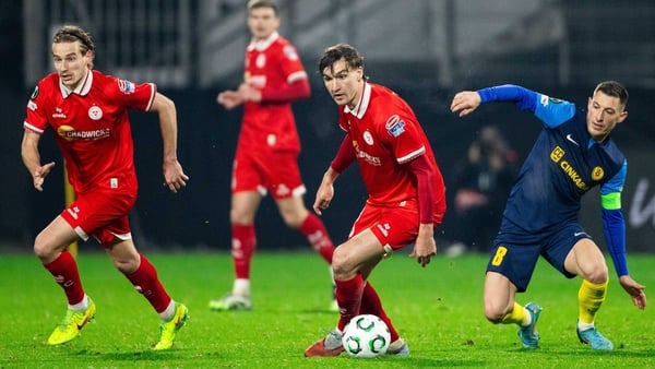 Shelbourne's Sean Boyd takes on Mario Kvesic of NK Celje