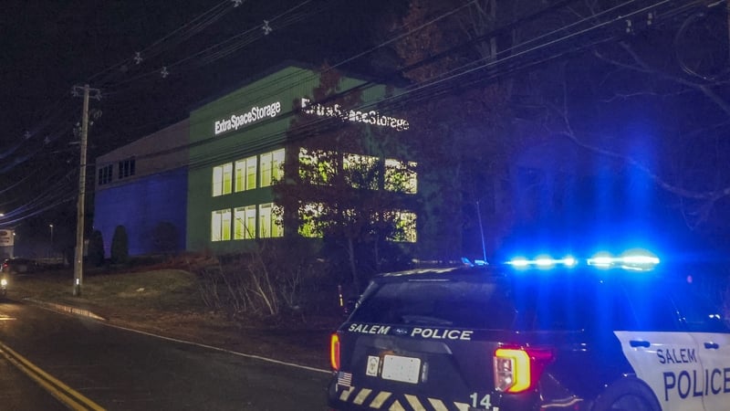 Police on scene at the Extra Space Storage facility where the Brown University shooting suspect was found dead