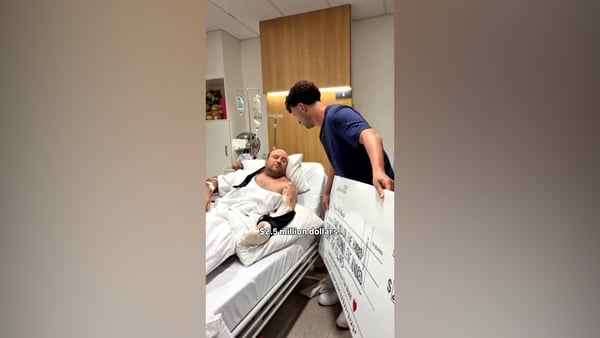 Ahmed al Ahmed presented with $2.5m cheque while in hospital bed