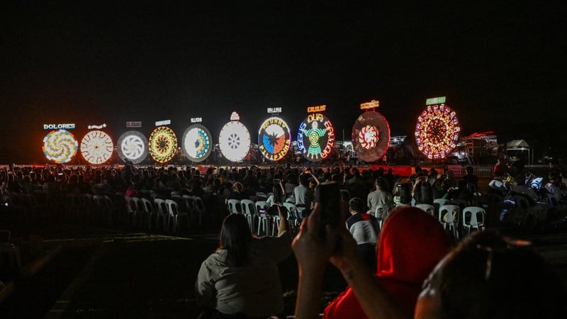 People watch the Giant Lantern Festival in San Fernando, Pampanga, Philippines