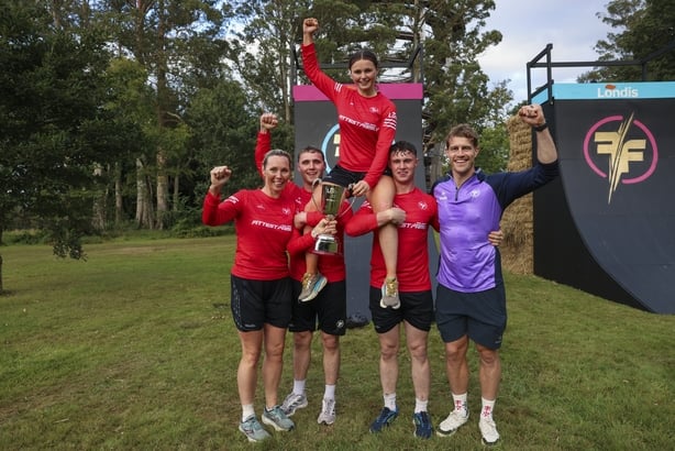 The McKenna family celebrating their win with coach Andrew Trimble