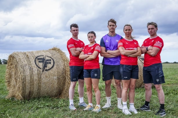 The McKenna family with coach Andrew Trimble