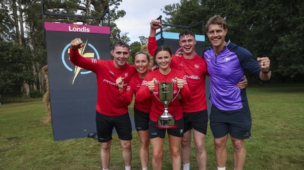 The McKenna family celebrating their win with coach Andrew Trimble