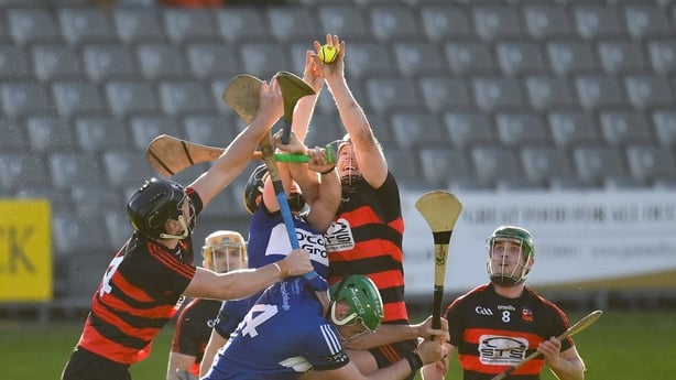 Philip Mahony of Ballygunner, centre, with the help of teammates Tadhg Foley, left, and Conor Sheahan, gathers the sliothar ahead of Daniel Hogan and James Sweeney of Sarsfields during the AIB Munster GAA Hurling Senior Club Championship semi-final match between Ballygunner and Sarsfields at Azzurri