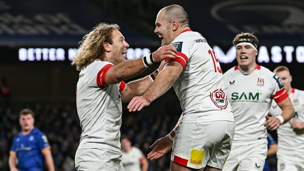 19 December 2025; Werner Kok of Ulster, left, celebrates with teammate Jacob Stockdale after scoring their side's first try during the United Rugby Championship match between Leinster and Ulster at the Aviva Stadium in Dublin. Photo by Ramsey Cardy/Sportsfile