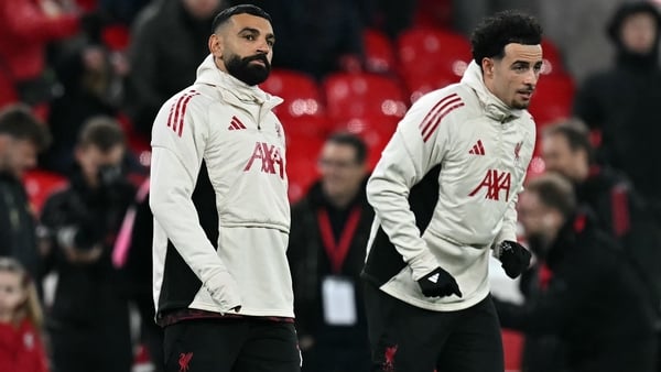 Liverpool's Egyptian striker #11 Mohamed Salah (L) and Liverpool's English midfielder #17 Curtis Jones warms up ahead of the English Premier League football match between Liverpool and Sunderland at Anfield in Liverpool, north west England on December 3,