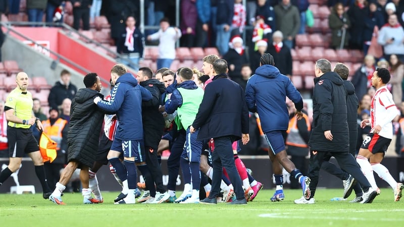 Players from both sides collide at the final whistle