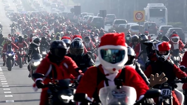 Hundreds of people dressed as Santa Claus ride motorbikes in Sofia