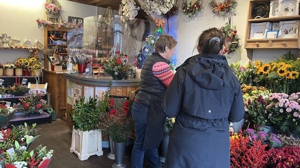 Photo show Audrey Healy working in her flower shop