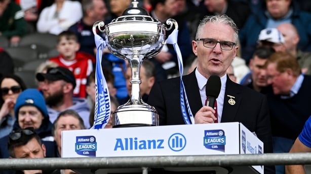 6 April 2025; Uachtarán Chumann Lúthchleas Gael Jarlath Burns, left, makes a speech in the company of Waterford captain Dessie Hutchinson and Allianz chief executive Geoff Sparling, after the Allianz Hurling League Division 1B final match between Waterford and Offaly at SuperValu Páirc Uí Chaoimh in
