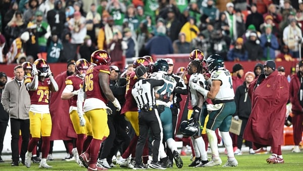 LANDOVER, MARYLAND - DECEMBER 20: Philadelphia Eagles and Washington Commanders players fight in the fourth quarter at Northwest Stadium on December 20, 2025 in Landover, Maryland. (Photo by Greg Fiume/Getty Images)
