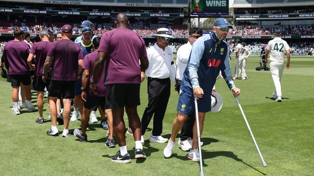 ADELAIDE, AUSTRALIA - DECEMBER 21: Nathan Lyon of Australia on crutches after doing a hamstring injury during the match during day five of the Third Test Match in the 2025-26 Ashes Series between Australia and England at Adelaide Oval on December 21, 2025 in Adelaide, Australia. (Photo by Sarah Reed