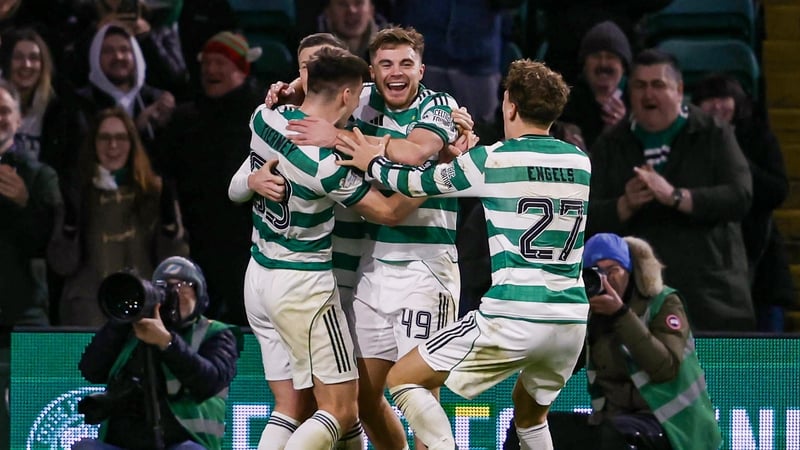 Celtic players celebrate James Forrest making it 3-1