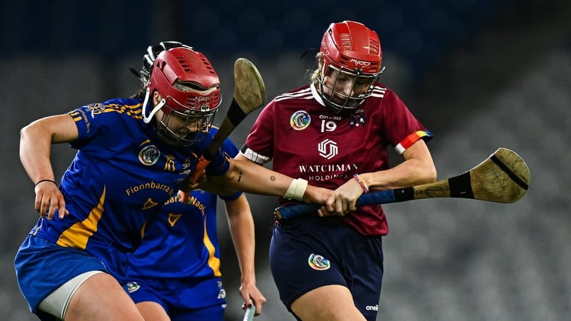 Therese Donohue of Athenry and St Finbarr's Sorcha McCartan scrap for possession