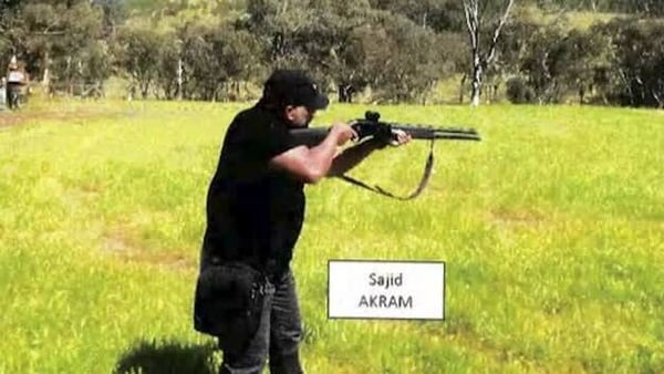 Court documents from police show Sajid Akram holding a firearm