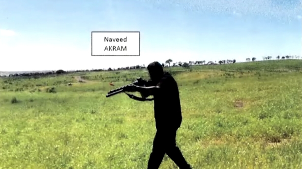 Naveed Akram pointing a firearm