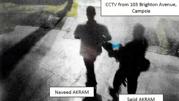 An image from CCTV footage shows Sajid and Naveed Akram carrying items wrapped in blankets in the early hours of 14 December 