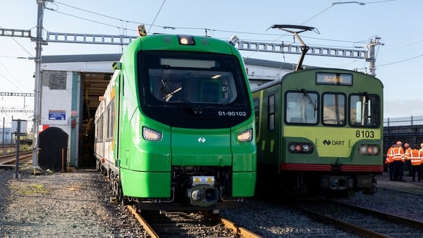 A new DART train beside an older model