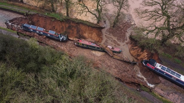 Several boats are seen stranded after a sinkhole opened at the canal in Shropshire