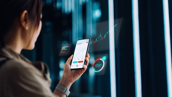 Asian businesswoman analyzing financial stock trading data on smartphone with virtual reality artificial intelligence (AI) technology. Stock exchange market trading board in background. Innovative mobile trading concept. Smart banking with technology