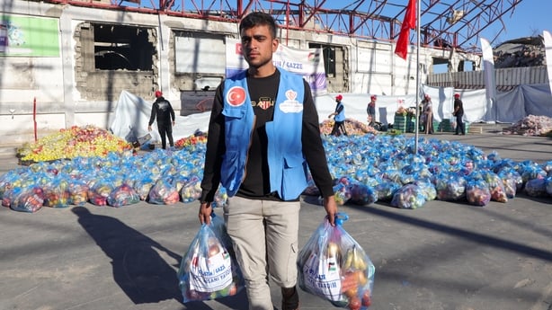 GAZA CITY, GAZA - DECEMBER 21: Officials are preparing aid packages sent by theTurkiye's Diyanet Foundation (TDV) to be distributed to needy Palestinians on December 21, 2025 in Gaza City, Gaza. (Photo by Abdalhkem Abu Riash/Anadolu via Getty Images)